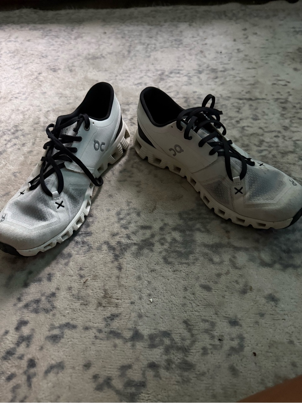 On Running White Athletic Shoes with Black Accents